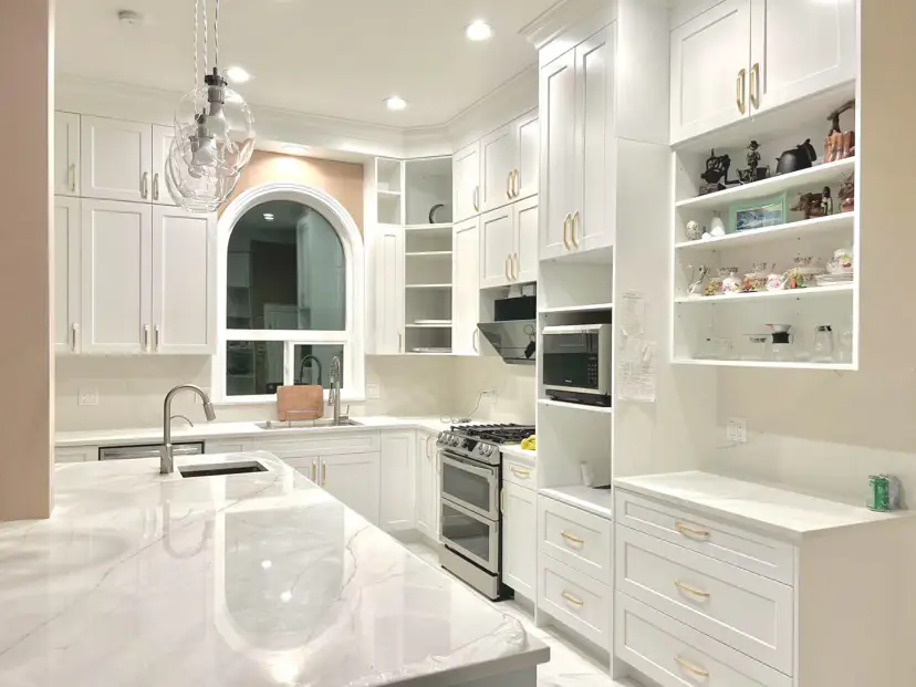 Kitchen renovation project showcase: modern white kitchen with quartz countertops and shaker cabinets in Vancouver home
