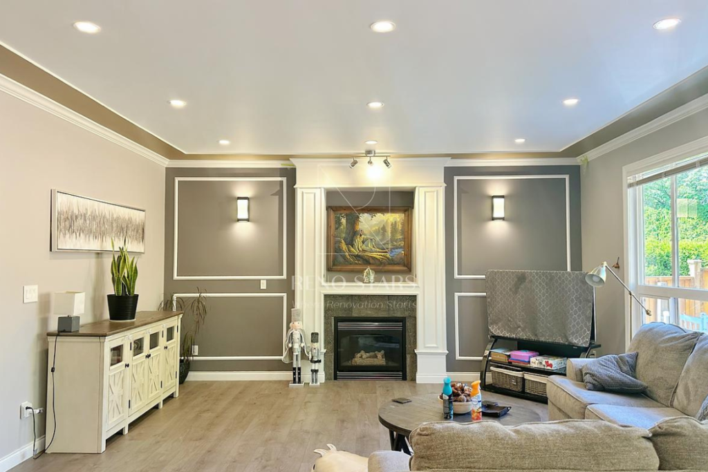 Basement transformation in Langley, BC by Reno Stars, featuring a cozy family room with modern design elements and ample lighting