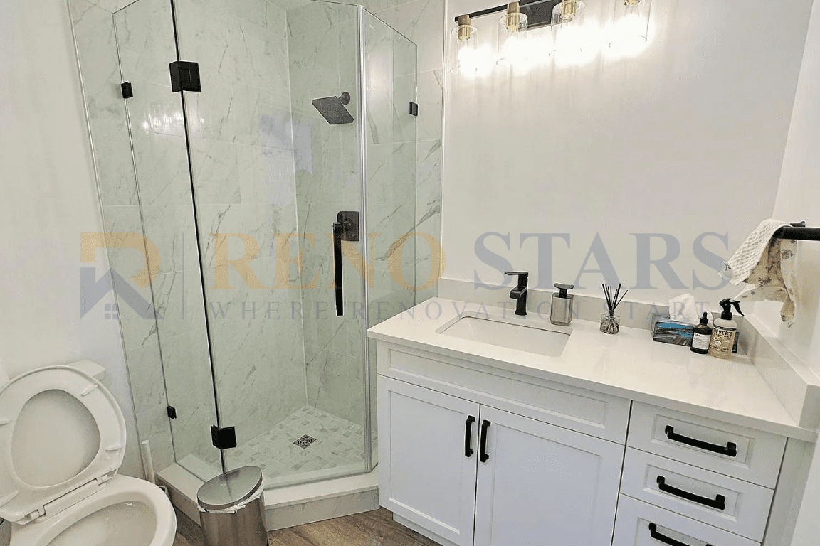 Modern bathroom renovation in Richmond with new tiles, shower fixtures, and lighting.