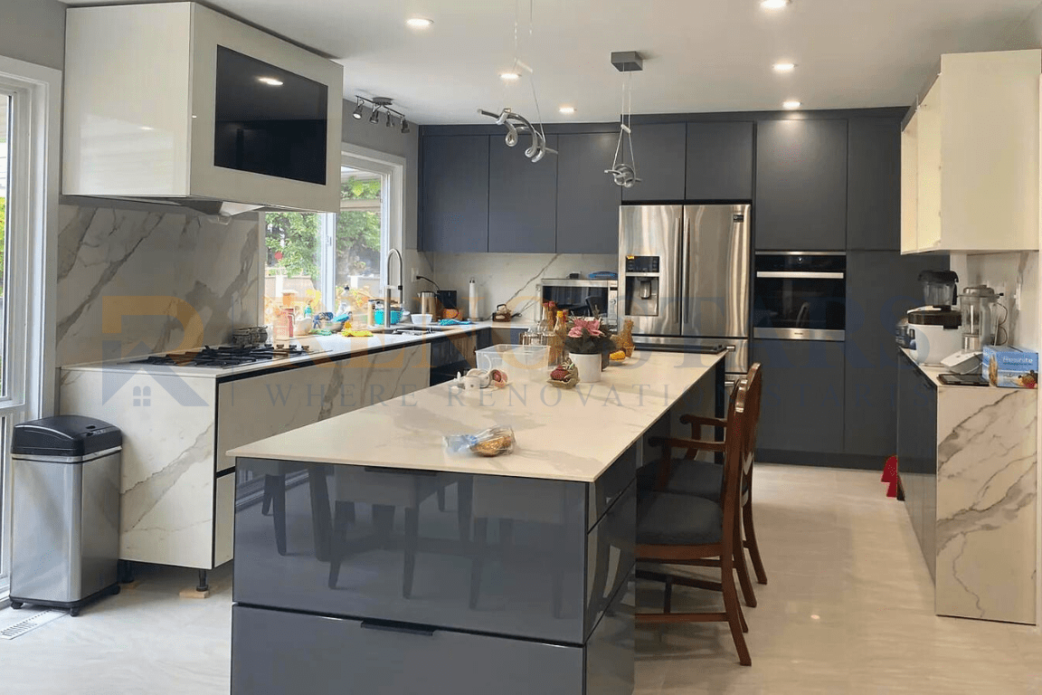 Full house renovation in Richmond, BC: Modern kitchen with sleek gray cabinetry, a large island, stainless steel appliances, and bright, contemporary lighting fixtures