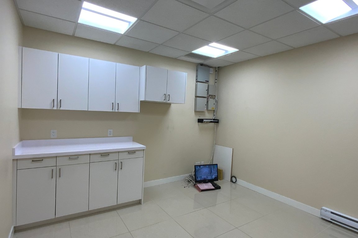 Before Renovation Serene Treatment Room with Custom Cabinets in Medical Spa Remodel in Vancouver​