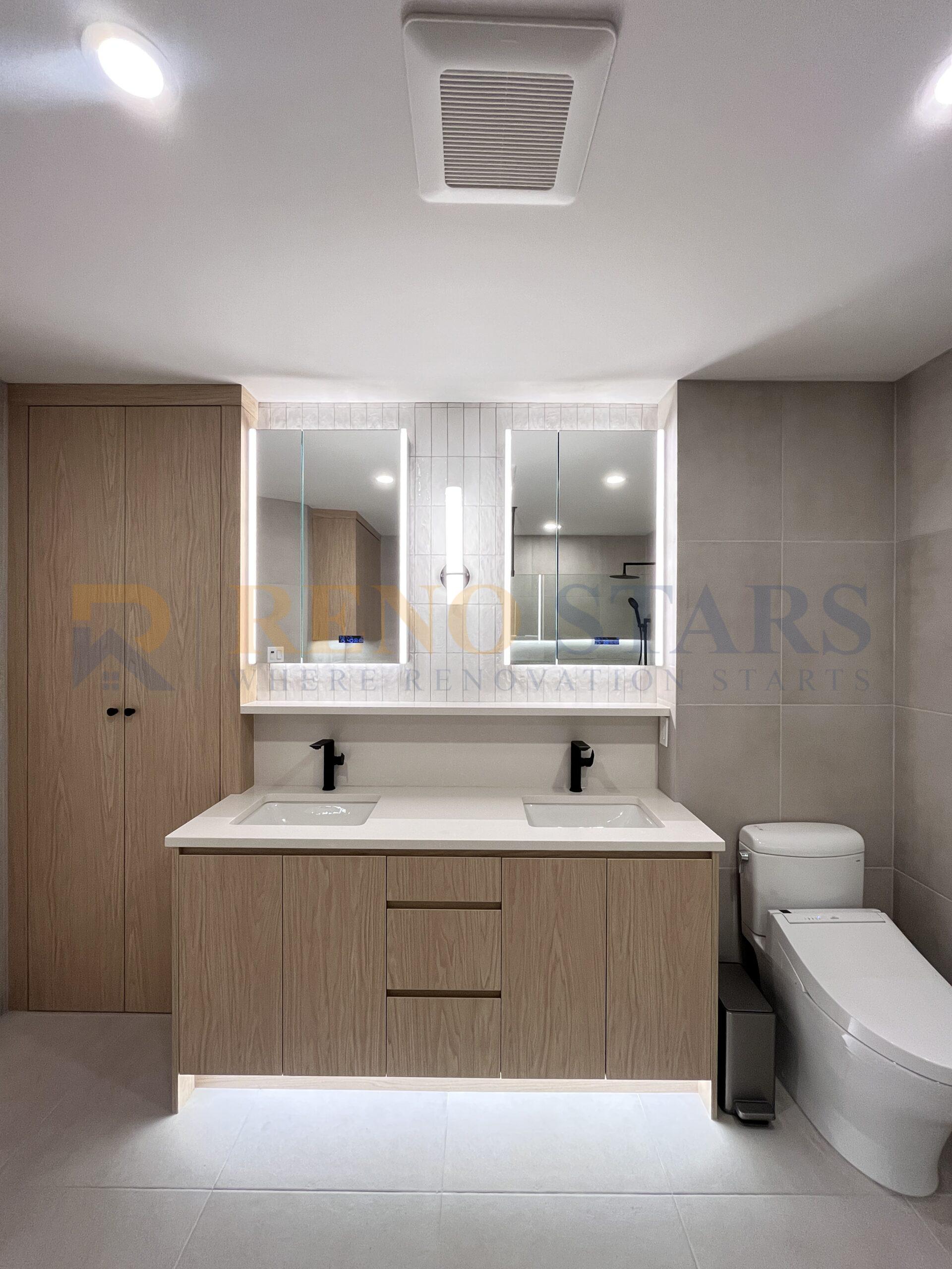 Double vanity bathroom with wood cabinets and LED mirror lighting.
